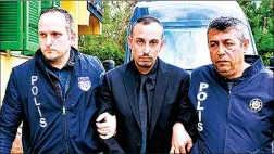  ??  ?? Melih Arnavut (centre) was sentenced to 17 years