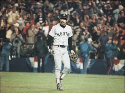  ?? THE ASSOCIATED PRESS — FILE PHOTO ?? Boston Red Sox first baseman Bill Buckner is a picture of dejection as he leaves the field after committing an error on a ball hit by New York Mets Mookie Wilson, which allowed the winning run to score in the sixth game of the 1986 World Series.