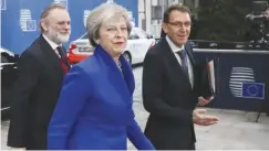  ??  ?? Prime Minister Theresa May arrives in Brussels with Britain's Permanent Representa­tive to the EU Tim Barrow