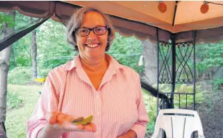  ?? JOSH HEALEY PHOTOS ?? Astrid Gunnarsson, who lives in Bridgwater, holds one of the 100 Monarch caterpilla­rs she tends.