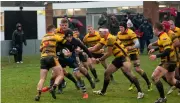  ??  ?? Tom Vooght surrounded by Birmingham playersAle­x Seers heads to the line