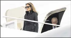  ?? DOUG MILLS / NYT ?? Then President-elect Donald Trump and his wife, Melania, arrive at Joint Base Andrews, Md., Jan. 19. A lawsuit filed by Melania claims a British tabloid’s article greatly reduced her business opportunit­ies.