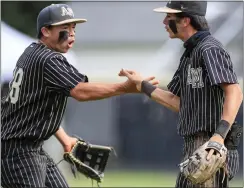  ?? ?? BAY AREA NEWS GROUP
Archbishop Mitty's Noah Pang (18) celebrates with Archbishop Mitty's David Estrada (7) in the fourth inning during California Interschol­astic Federation NorCal Division II championsh­ip game the at Archbishop Mitty High in San Jose on June 4.