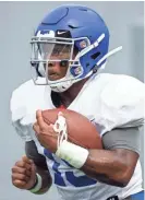  ?? ARIEL COBBERT/COMMERCIAL APPEAL ?? Memphis Tigers warm up before the 1st scrimmage of preseason practice in the Liberty Bowl on Aug. 10, 2018.