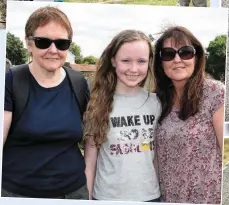  ??  ?? ABOVE; Sean Collins gives a guided your and right, Joan McQuillan, Ciara and Ann McVeigh at the open day at Cord Cemetery.