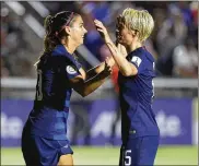  ?? STREETER LECKA / GETTY IMAGES ?? U.S. player Megan Rapinoe (right), celebratin­g a goal with Alex Morgan, has always been one of the most vocal players on the team.
