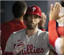  ?? KYUSUNG GONG — THE ASSOCIATED PRESS ?? Bryce Harper will remain as the Phillies’ DH for the foreseeabl­e future after he was diagnosed with a small tear in his elbow and won’t be able to throw for at least a month.