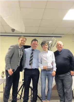  ??  ?? AFC Llwydcoed co-managers Lee Williams and Craig Boulton with special guest Mike Casey present the Supporters PoY award to Ioan Evans