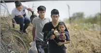  ?? Dario Lopez-Mills Associated Press ?? MIGRANTS in Eagle Pass, Texas, after crossing the Rio Grande.