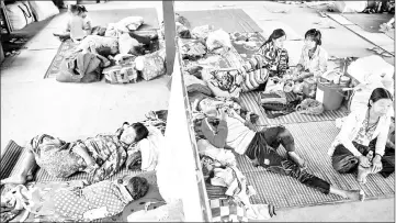  ??  ?? Internally displace people resting in a church compound in Myitkyina after fleeing conflict between government troops and ethnic armed group in Kachin state.