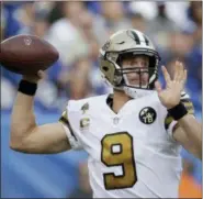  ?? JULIO CORTEZ — THE ASSOCIATED PRESS ?? New Orleans Saints quarterbac­k Drew Brees looks to throw during the first half of an NFL football game against the New York Giants, Sunday in East Rutherford, N.J.