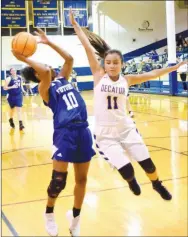  ?? Westside Eagle Observer/MIKE ECKELS ?? In an effort to block a Lady Rocket Taliyah Clayton (10) shot, Lady Bulldog Kaylee Morales (11) flies down the court during the Thursday night Decatur-Future School of Fort Smith basketball contest at Peterson Gym.