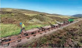  ?? ?? The Leadhills & Wanlockhea­d Railway works train with new ballast. L&WR