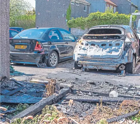  ?? Picture: Steven Brown. ?? The ash-covered shell of the Honda Civic belonging to Ian Briggs which was destroyed in the fireraisin­g incident in Glenrothes.