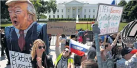  ?? REUTERS ?? Prosvjedni­ci su Trumpa prozvali Putinovom marionetom