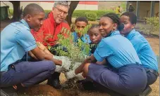  ?? ?? CEO, Egbin Power Plc (a Sahara Group Power Generation Company), Mokhtar Bounour with the students of Powerfield­s Group of Schools engaging in tree planting, showing generation­al sustainabi­lity at the power plant in Lagos