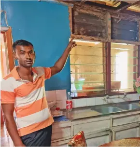  ?? Photo: Sampras Anand ?? Avinesh Anand shows the damaged section of the kitchen at his home in Bulileka, Labasa on October 11, 2021.