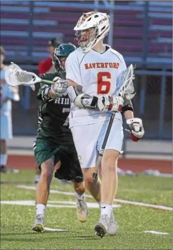  ?? PETE BANNAN — DIGITAL FIRST MEDIA ?? Haverford’s Jack Daly keeps the ball from Ridley’s Evan Bosak in the first half Thursday. Daly contribute­d four goals and six assists in a 13-6 Fords win.