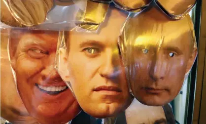  ?? Photograph: Anatoly Maltsev/EPA ?? Masks of Donald Trump, Alexei Navalny and Vladimir Putin on sale in St Petersburg.