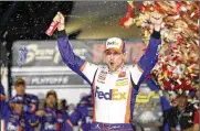  ?? STEVE MARCUS / AP ?? NASCAR Cup Series driver Denny Hamlin (11) celebrates in victory lane after winning a NASCAR Cup Series race Sunday at Las Vegas Motor Speedway.