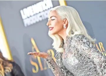  ??  ?? Lady Gaga and Cooper (inset below) attends the premiere of ‘A Star is Born’ at the Shrine Auditorium in Los Angeles, California on Monday. — AFP photos