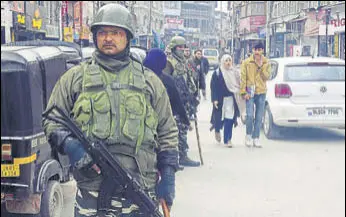  ?? ANII ?? CRPF personnel keep vigil after militants killed two police personnel, in Srinagar on Saturday.