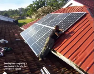  ??  ?? Sales Engineer completing a solar back up system for the University of Nairobi