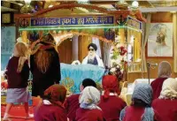  ??  ?? The children from Bosley St Mary’s Primary School during their visit to the Sikh temple