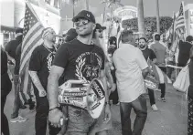  ?? PEDRO PORTAL pportal@miamiheral­d.com ?? Enrique Tarrio, in front of the Versailles Restaurant on Calle Ocho, before his arrest in connection with the storming of the U.S. Capitol. The Miamian, once a leader of the group, is no longer in charge.