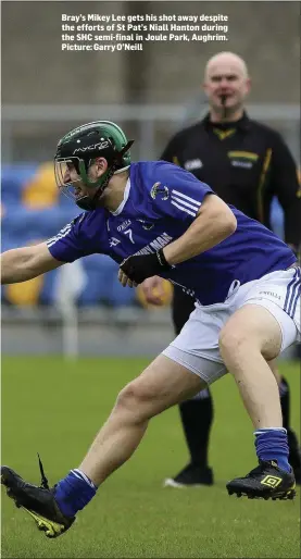  ??  ?? Bray’s Mikey Lee gets his shot away despite the efforts of St Pat’s Niall Hanton during the SHC semi-final in Joule Park, Aughrim. Picture: Garry O’Neill