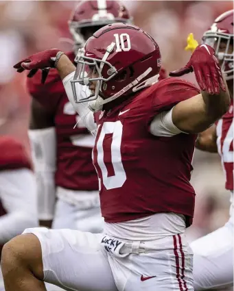  ?? AP ?? TOO, TOO MUCH: Alabama linebacker Henry To'oTo'o celebrates a defensive stop during the first half against Mississipp­i on Saturday in Tuscaloosa, Ala.