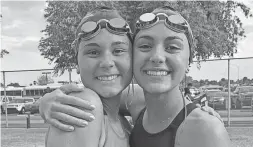  ?? MCLENNA FAMILY ?? Gilbert team captain Gabi McLenna, left, with older sister Dani, is battling brain cancer as she cheers for her teammates.