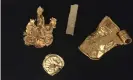  ?? Photograph: British Museum/PA ?? Gold bracteate, gold bar and two further artefacts thought to be jewellery fragments, discovered in Norfolk, part of a hoard that Norwich Castle Museum hopes to acquire.