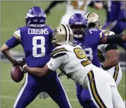  ?? BUTCH DILL — THE ASSOCIATED PRESS ?? New Orleans Saints defensive end Cameron Jordan strips the ball from Minnesota Vikings quarterbac­k Kirk Cousins as he sacks him in the second half of Friday’s game. The Saints recovered the ball.