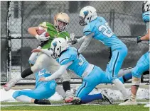  ?? GARY YOKOYAMA THE HAMILTON SPECTATOR ?? Notre Dame’s Jacob Succar, with the ball, is stopped short of the end zone in Southern Ontario Secondary Schools Associatio­n championsh­ip football versus Hamilton Westmount on Tuesday at Ron Joyce Stadium in Hamilton.