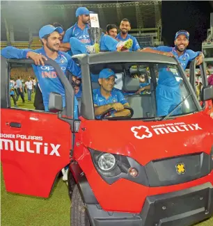  ?? PTI ?? ms Dhoni drives a vehicle with members of the indian cricket team after their ODi series win over sri Lanka in Colombo, sri Lanka on sunday. —