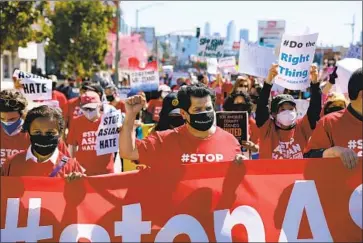  ?? Dania Maxwell Los Angeles Times ?? U.S. REP.
Jimmy Gomez, center, marches during a rally against anti-Asian hate in Koreatown on Saturday.