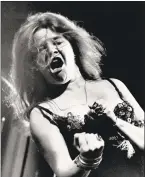  ?? / AP ?? Blues/ rock singer Janis Joplin performs at the Newport Folk Festival with her band Big Brother and the Holding Company in 1968.