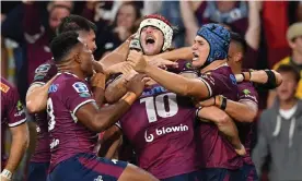  ??  ?? James O’Connor and his Queensland Reds teammates celebrate the match-winning try in the Super Rugby AU final at Suncorp Stadium. Photograph: Darren England/AAP