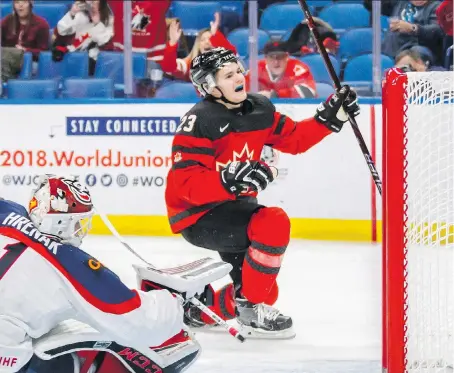  ?? PHOTOS: MARK BLINC/THE CANADIAN PRESS ?? Team Canada forward Sam Steel celebrates his goal against Slovakian goalie David Hrenak during their 6-0 world juniors preliminar­y round win Wednesday in Buffalo.