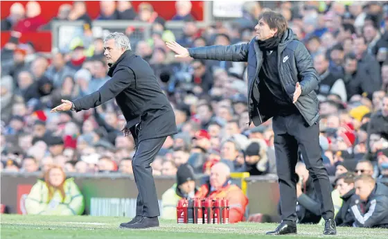  ??  ?? Manchester United manager Jose Mourinho, left, and Chelsea boss give instructio­ns to their players during a Premier League match.