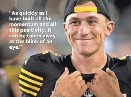  ?? PETER POWER/AP ?? Johnny Manziel has reason to smile even though he’s coming off the bench for the CFL’s Tiger-Cats.