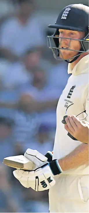  ??  ?? Eye on the ball: Jack Leach cleans his glasses during his heroic innings