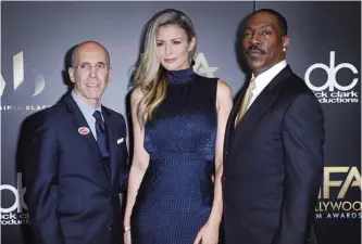  ?? —AP/AFP photos ?? Jeffrey Katzenberg, CEO of DreamWorks Animation, from left, Paige Butcher and Eddie Murphy arrive at the 20th annual Hollywood Film Awards.