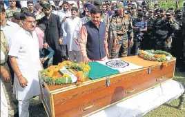  ?? HT PHOTO ?? ■ Tributes being paid to slain soldier Aurangzeb at his native village, Salani, in Poonch.