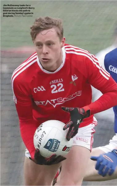  ??  ?? Jim McEneaney looks for a teammate as Longford’s Barry Gilleran blocks the path to goal during Sunday’s game in Drogheda. Picture: Paul Connor