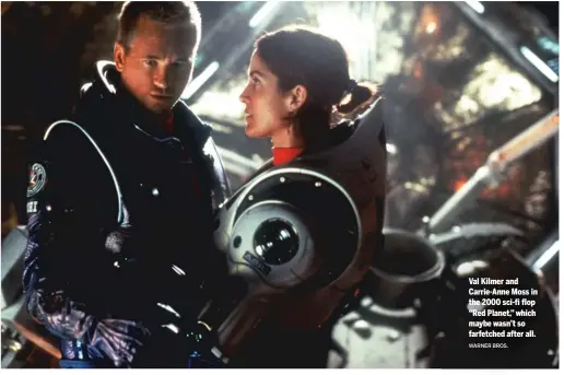  ?? WARNER BROS. ?? Val Kilmer and Carrie-Anne Moss in the 2000 sci-fi flop “Red Planet,” which maybe wasn’t so farfetched after all.