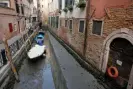  ?? ?? The unusually low tides are making it impossible for gondolas, water taxis and ambulances to navigate some of Venice’s canals. Photograph: Manuel Silvestri/Reuters