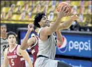  ?? Cliff Grassmick / Staff Photograph­er ?? Colorado’s Evan Battey drives to the basketball on Saturday against Stanford at CU Events Center.