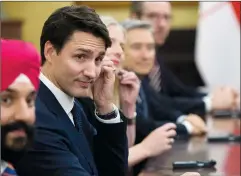  ?? CP PHOTO SEAN KILPATRICK ?? Prime Minister Justin Trudeau sits with Innovation, Science and Economic Developmen­t Minister Navdeep Singh Bains as they meet with Chinese President Xi Jinping at the Diaoyutai State Guesthouse in Beijing, China on Tuesday.